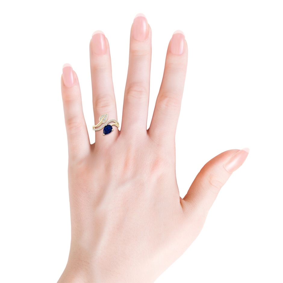 8x6mm AA Sapphire and Diamond Bypass Ring with Leaf Motif in Yellow Gold body-hand