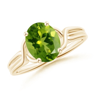 9x7mm AAAA Classic Oval Peridot Criss-Cross Cocktail Ring in Yellow Gold