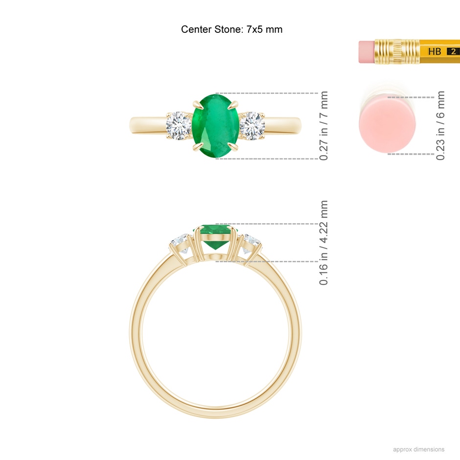 7x5mm A Oval Emerald and Round Diamond Three Stone Ring in Yellow Gold ruler