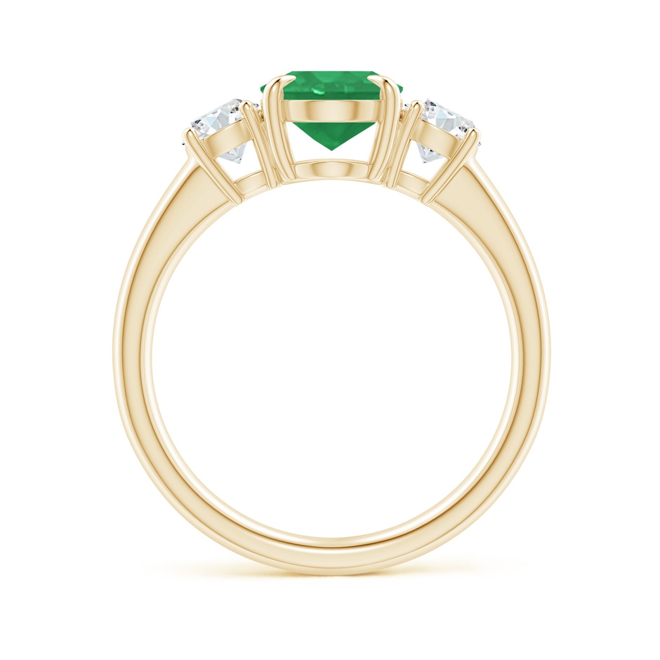9x7mm A Oval Emerald and Round Diamond Three Stone Ring in Yellow Gold side 1