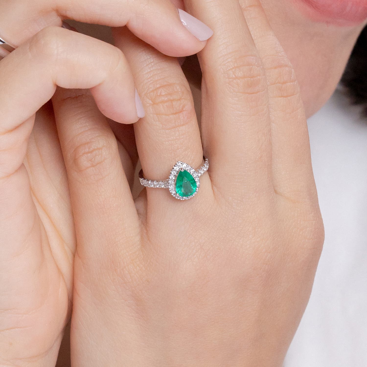 Pear shaped emerald and clearance diamond ring