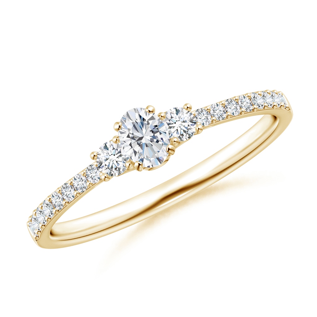 4x3mm GVS2 Oval and Round Diamond Three Stone Ring with Accents in Yellow Gold