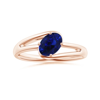 6.95x5.08x3.30mm AAAA Solitaire Tilted Oval Sapphire Bypass Split Shank Ring in 10K Rose Gold