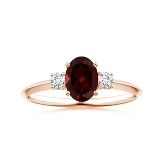 8.16x6.07x3.91mm AAA GIA Certified Three Stone Oval Garnet Knife-Edged Shank Ring in 9K Rose Gold