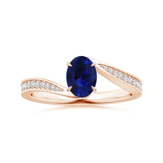 6.95x5.08x3.30mm AAAA Claw-Set Oval Blue Sapphire Bypass Ring with Diamonds in 9K Rose Gold