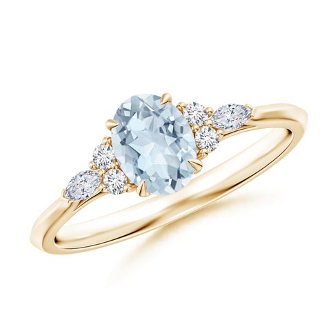 7x5mm A Oval Aquamarine Side Stone Engagement Ring with Diamonds in Yellow Gold