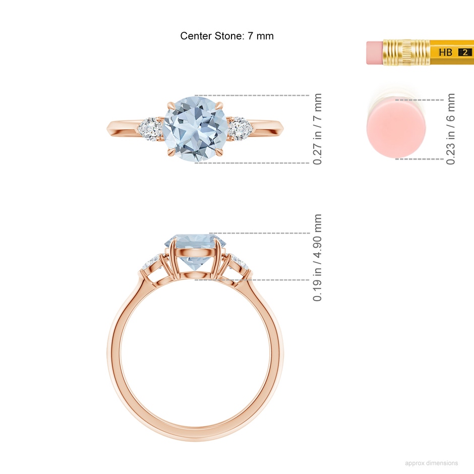 7mm A Round Aquamarine and Pear Diamond Three Stone Engagement Ring in Rose Gold ruler