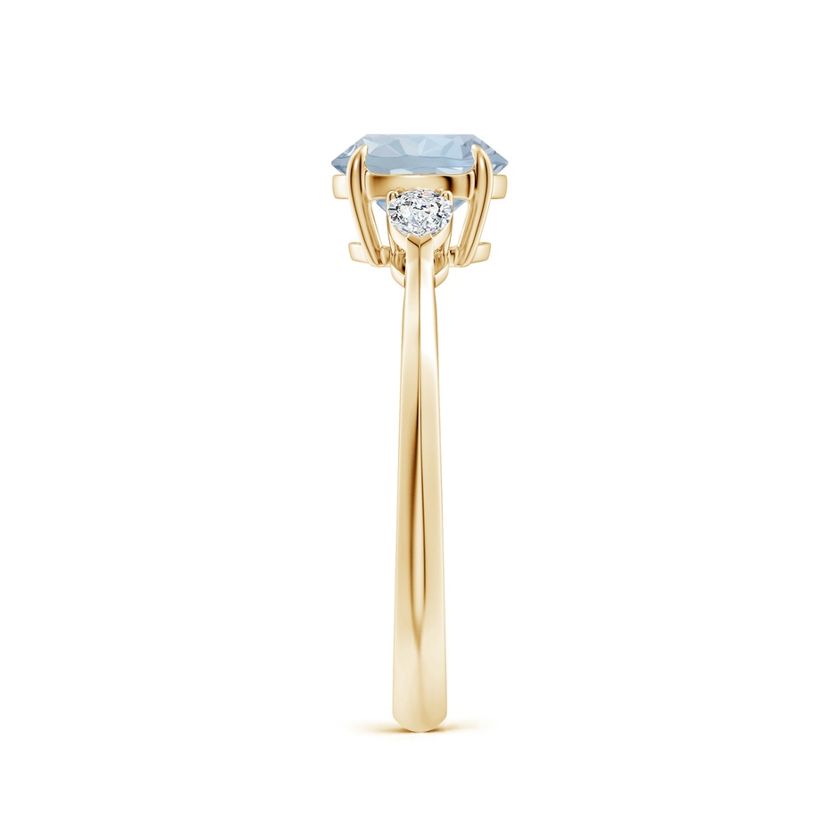 7mm A Round Aquamarine and Pear Diamond Three Stone Engagement Ring in Yellow Gold side 299