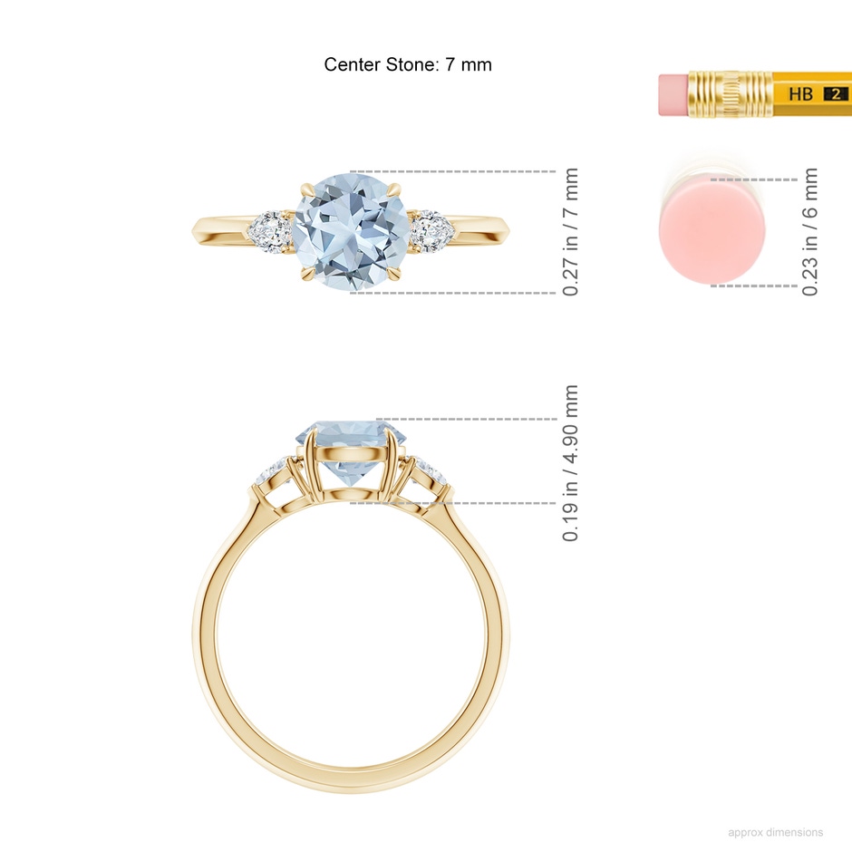 7mm A Round Aquamarine and Pear Diamond Three Stone Engagement Ring in Yellow Gold ruler