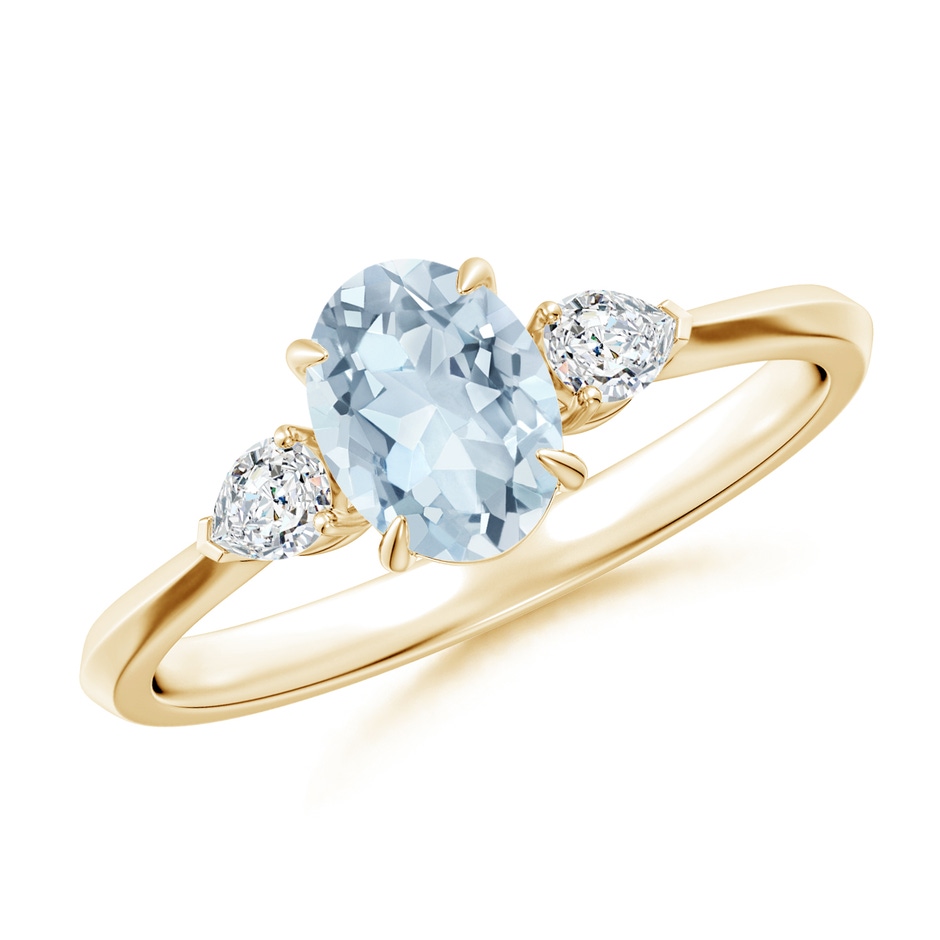 7x5mm A Oval Aquamarine and Pear Diamond Three Stone Engagement Ring in Yellow Gold 