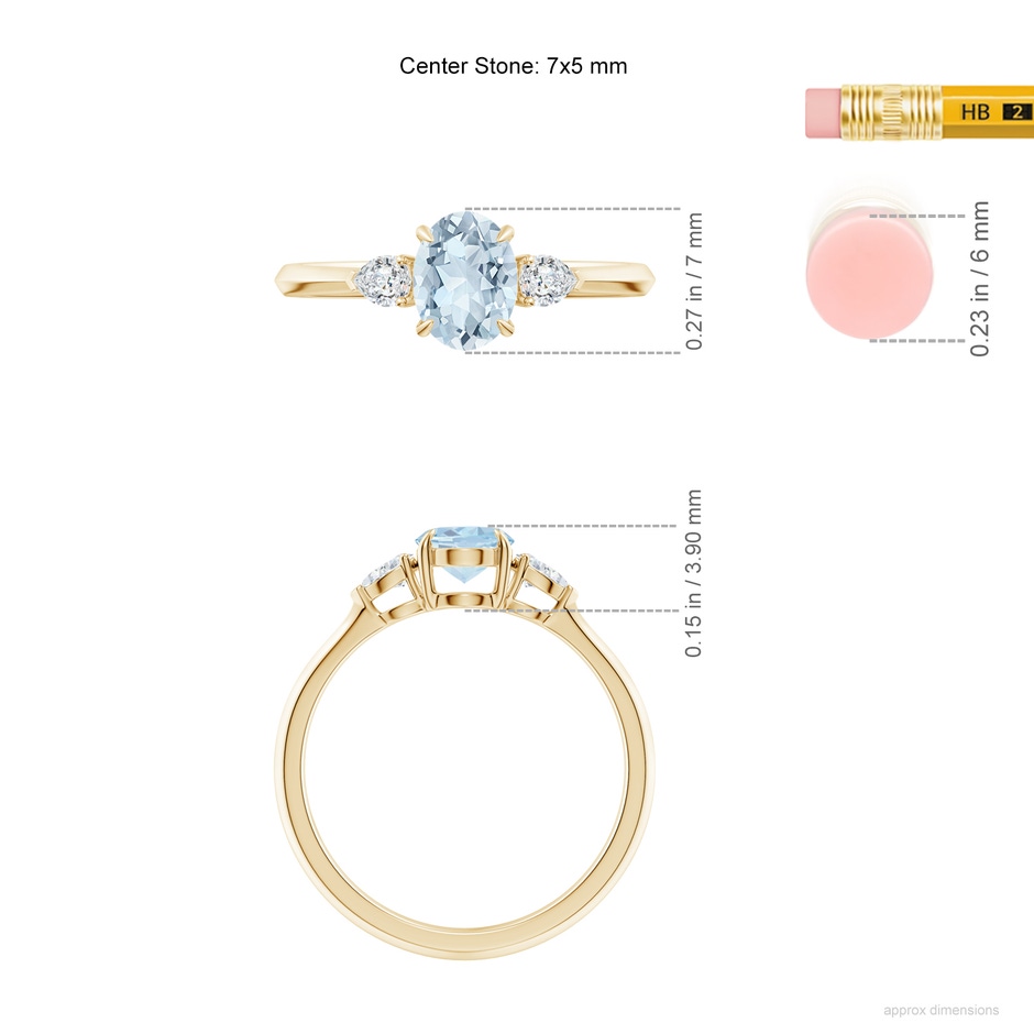 7x5mm A Oval Aquamarine and Pear Diamond Three Stone Engagement Ring in Yellow Gold ruler