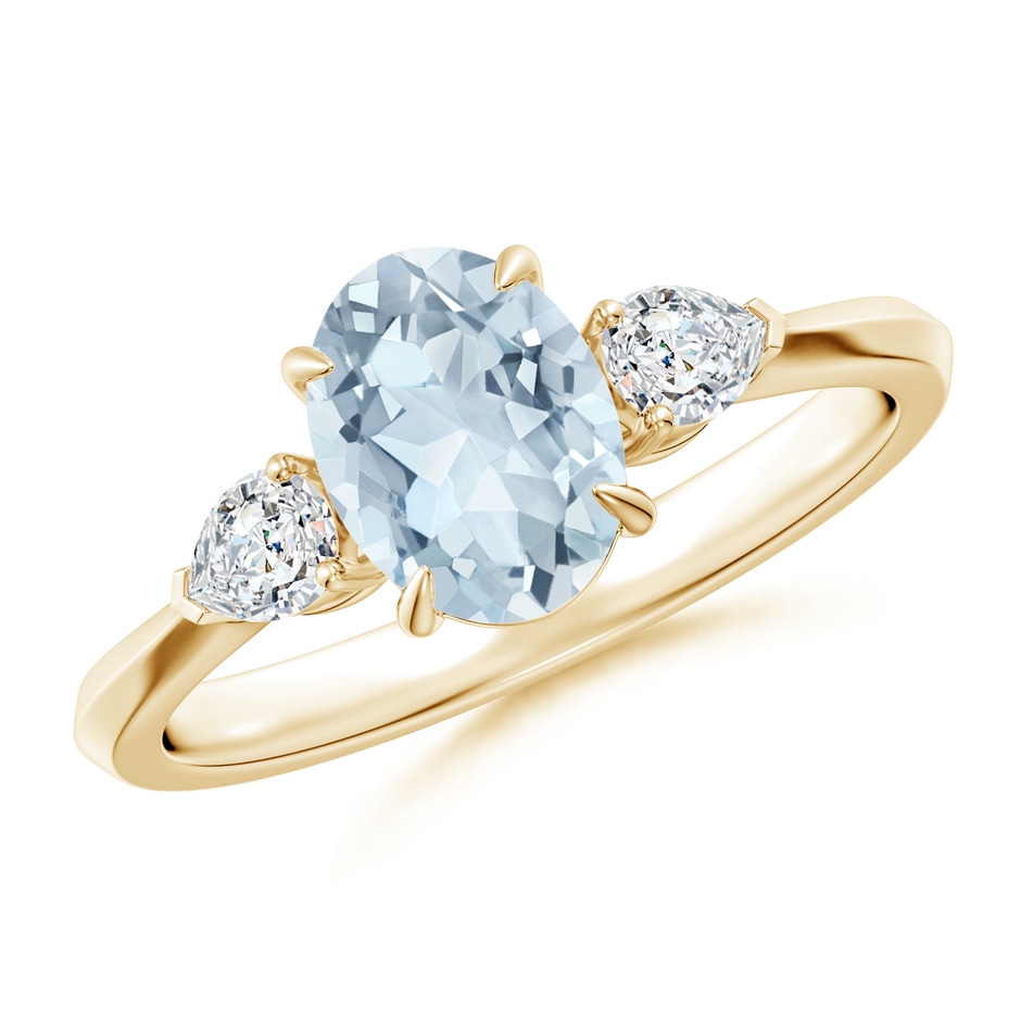 8x6mm A Oval Aquamarine and Pear Diamond Three Stone Engagement Ring in Yellow Gold 