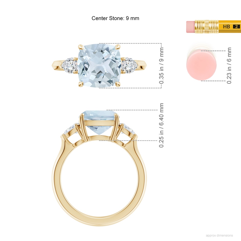 9mm A Cushion Aquamarine and Pear Diamond Three Stone Engagement Ring in Yellow Gold ruler