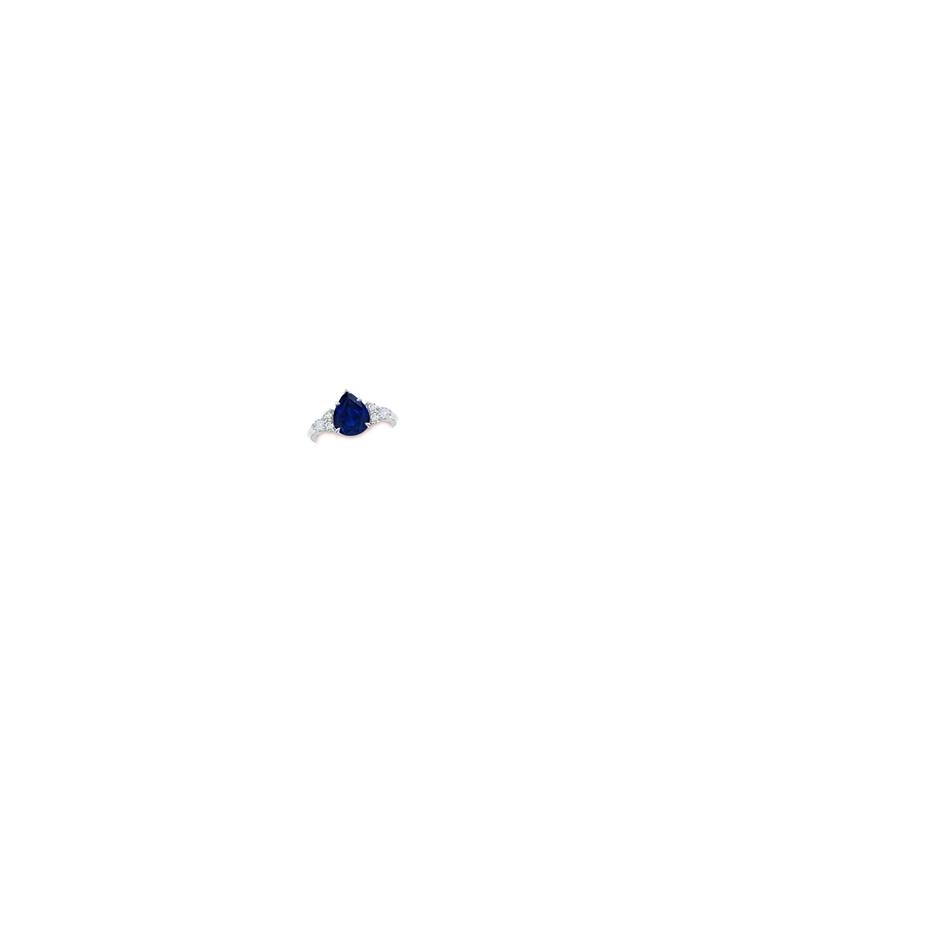 10x8mm AA Pear Shape Blue Sapphire Side Stone Engagement Ring with Diamonds in White Gold hand