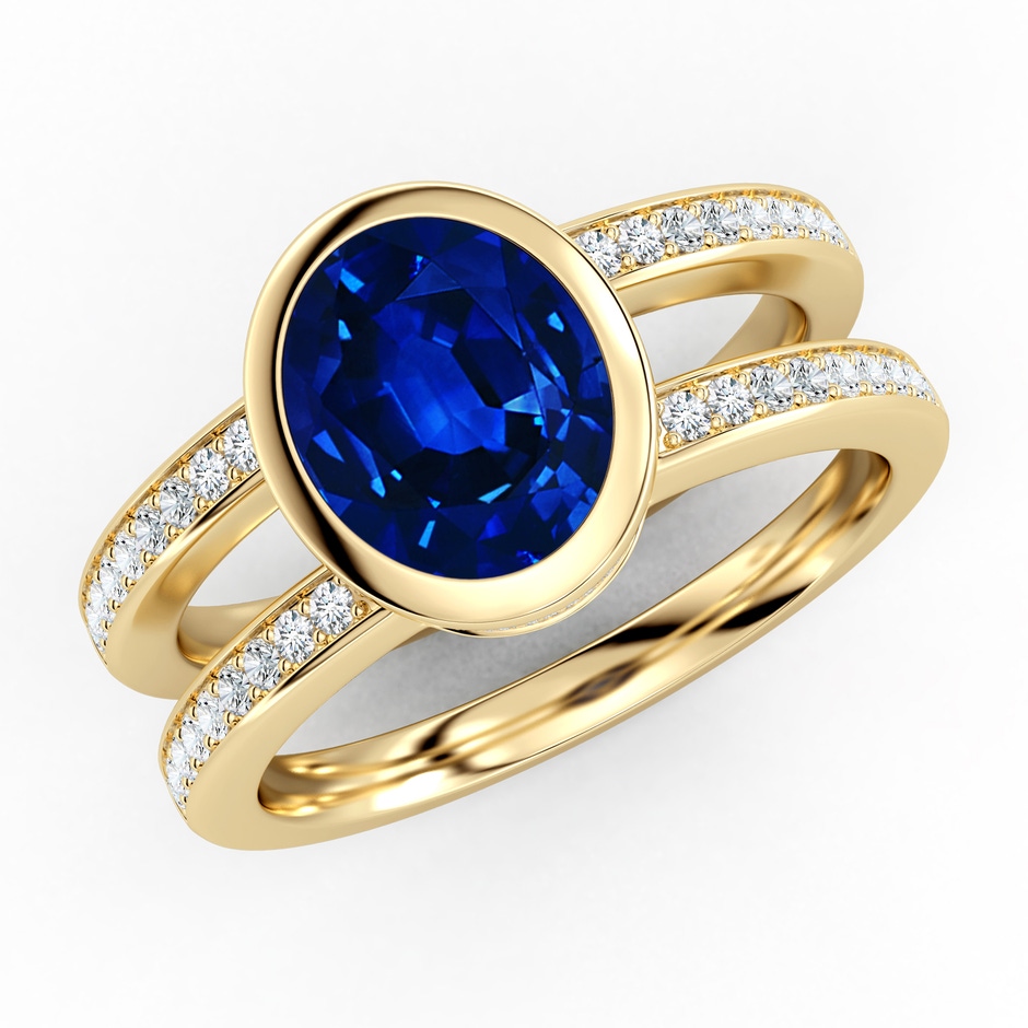 9x7mm AAAA Bezel-Set Oval Blue Sapphire Dual Shank Ring with Accents in Yellow Gold 