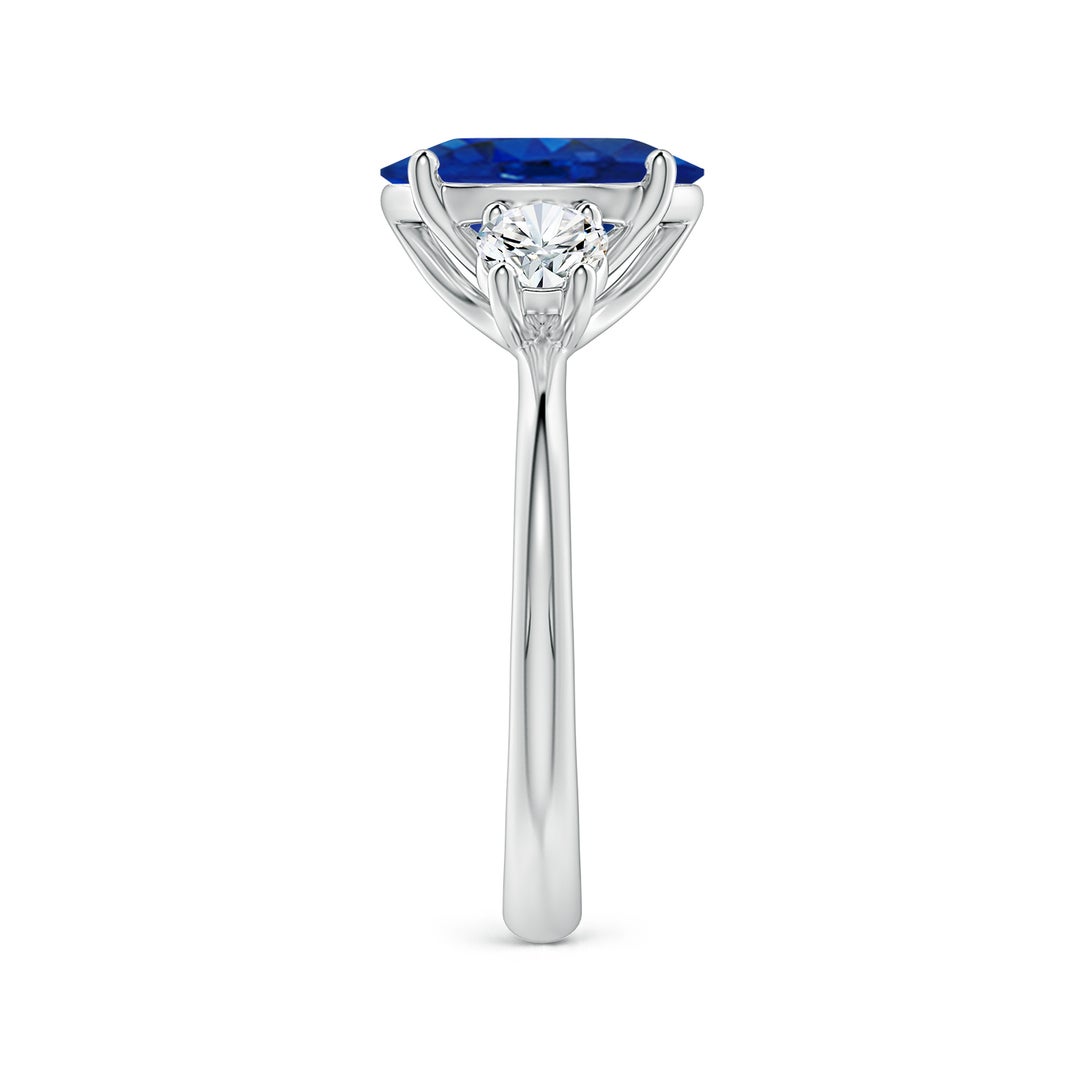 10x8mm AAA Oval Blue Sapphire and Round Diamond Three-Stone Engagement Ring in White Gold - side 3
