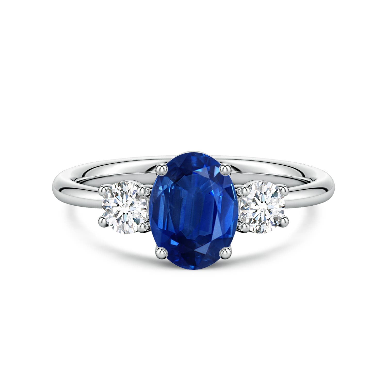 8x6mm AAA Oval Blue Sapphire and Round Diamond Three-Stone Engagement Ring in White Gold