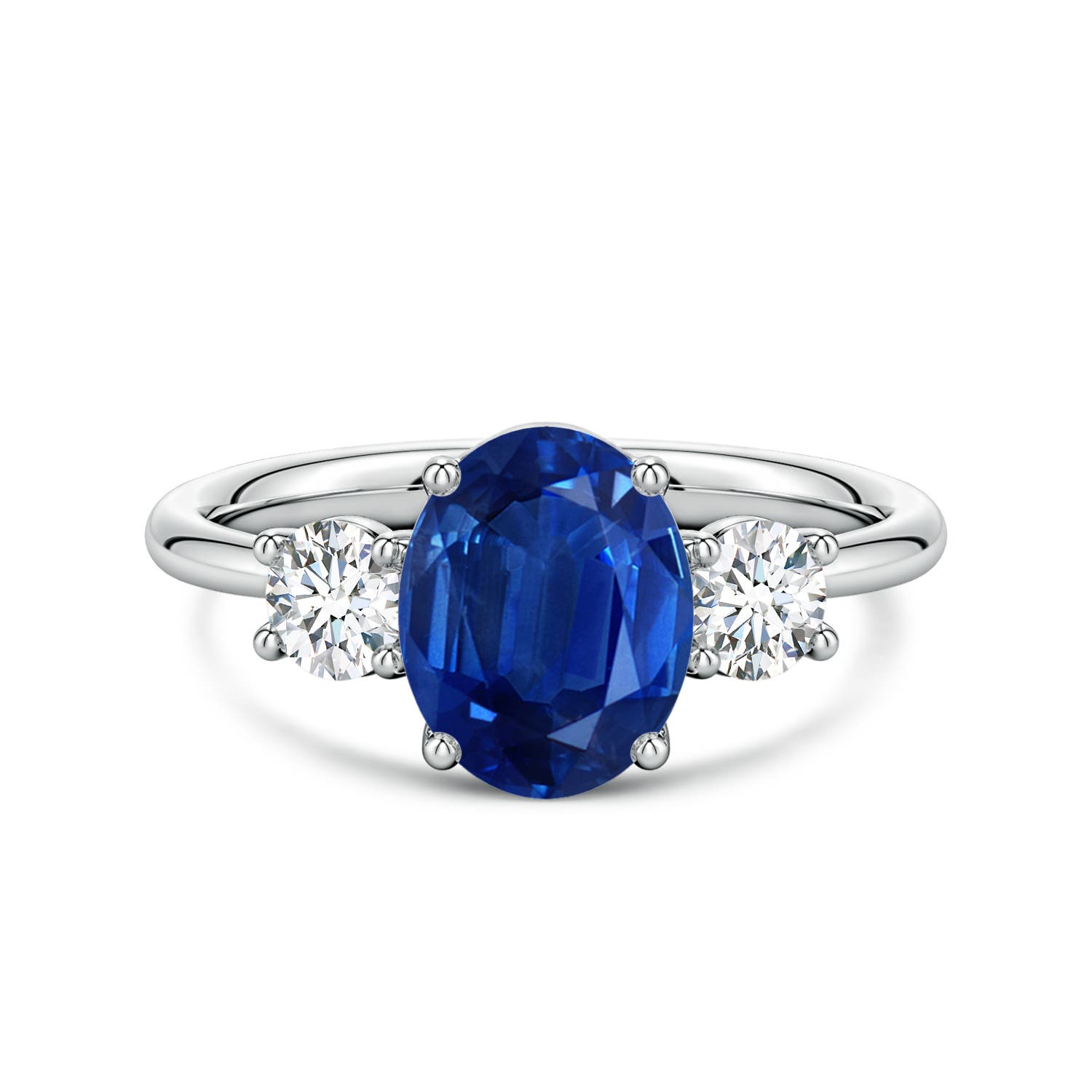 9x7mm AAA Oval Blue Sapphire and Round Diamond Three-Stone Engagement Ring in White Gold